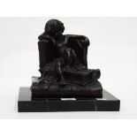 Art Deco style bronzed-effect sculpture of a child sitting on books, on a marbled base,