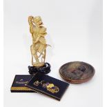 Late 19th century Chinese carved ivory figure of a dancing Oni, on carved wooden base,