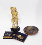 Late 19th century Chinese carved ivory figure of a dancing Oni, on carved wooden base,