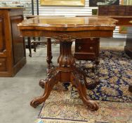 Victorian rosewood card table with hinged top, on quadruped carved cabriole legs and castors,