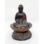 Late 18th/early 19th century lacquered carved wooden model of a seated Buddha with gilt highlights,