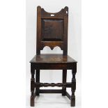 Late 18th/early 19th century oak standard chair with shaped crest rail and field panelled back,