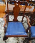 Pair of mahogany-framed elbow chairs with vase-shaped splats,