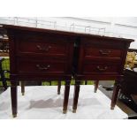 Pair of mahogany side tables with raised border surrounds and two short drawers below,