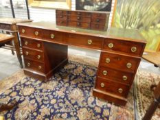 Mahogany kneehole pedestal desk having tooled leather inset top,