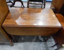 19th century mahogany Pembroke table fitted a drawer to frieze and on turned supports,