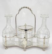 Victorian silver tantalus with two cut glass decanters and a silver-mounted ice bucket,
