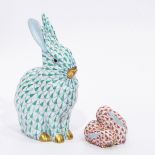 Herend model of a rabbit with green decoration, 13cm high and a Herend model group of two rabbits,