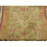 Laura Ashley rug, the cream ground with stylised foliate red decoration,