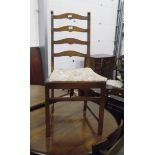 Set of four stained beech ladderback dining chairs (two carvers and two standards)