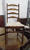 Set of four stained beech ladderback dining chairs (two carvers and two standards)