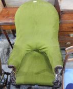 Victorian upholstered mahogany-framed easy chair with carved shewwood and on turned supports and