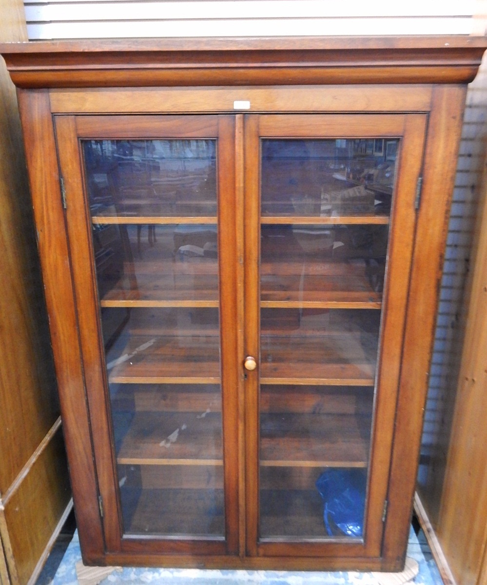 Victorian mahogany bookcase enclosed by two glass panelled doors,