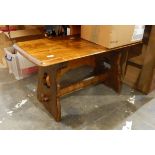Wooden coffee table with the base/top of a desk and a small white painted half-moon table