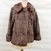 Squirrel jacket with a single button fastening,