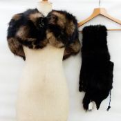 Black fox scarf, a red fox scarf (both with heads and tails),