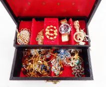 Quantity of costume jewellery in black leather jewellery box and an Exactima wristwatch