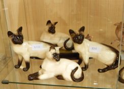 Beswick model Siamese cat with mouse and four other Siamese cats