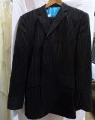 Oswald Boateng striped suit, the jacket with bright turquoise lining,