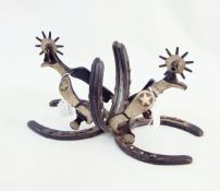 Pair of bookends made from two cast horseshoes and cast cowboy spurs with rowel,