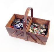 Vintage sewing box containing a large assortment of buttons and buckles, including bakelite, paste,