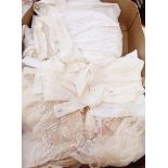 Assorted lace pieces and remnants, an embroidered silk shawl, nylon, cotton and linen aprons, etc.