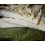 Large linen tablecloth with deep crocheted border, assorted braids, a green embroidered bedspread,