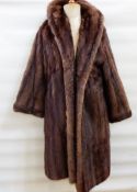 Vintage musquash fur coat labelled 'Griffin & Spalding' and a full-length squirrel coat labelled