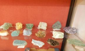 Collection of mineral and rock samples including ruby in zoisite, celestine, dioptase,