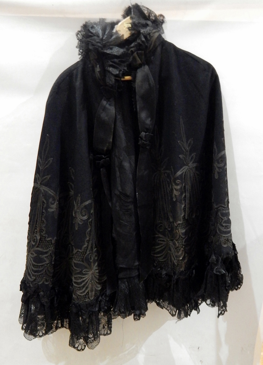 Black wool Victorian cloak, heavily embroidered with ribbon detail,