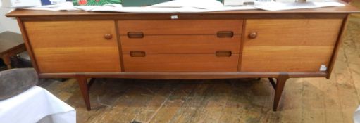 Teak sideboard by Younger, circa 1960's with three central drawers flanked by cupboards,