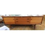 Teak sideboard by Younger, circa 1960's with three central drawers flanked by cupboards,