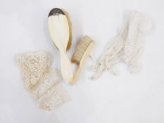 Ivory brush, a small ivory clothes brush,