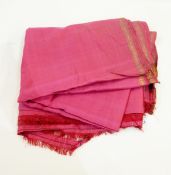 A pink silk sari bordered with gold thread