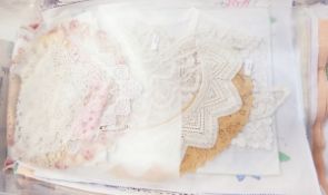 Quantity of embroidered dressing table mats, placemats, crocheted doilies,