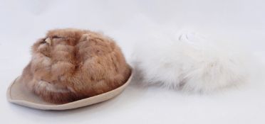 Large selection of fur hats including mink, swansdown, faux-fur, a small fur hat (possibly ocelot),