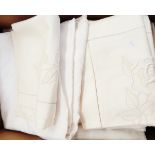 Large quantity of matching table linen including tablecloths, runners, various napkins, doilies,