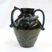 Brannam Barum pottery two-handled vase with dark green ground decorated with relief of lizard and