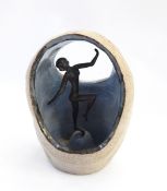 Bronze Art Deco style figure of a female nude, surrounded in a ceramic dome,