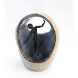 Bronze Art Deco style figure of a female nude, surrounded in a ceramic dome,