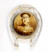 Late 19th/early 20th century pressed glass paperweight in the form of a horseshoe with a portrait