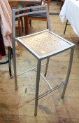 20th century silver coloured metal and wooden inset seat bar stool and a set of four matching