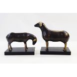 Pair of metal modelled sheep, one grazing..