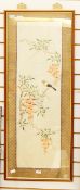 Oriental embroidered picture on silk depicting a bird sitting on a blossom tree branch,