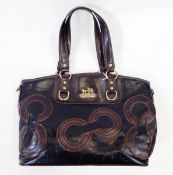 Coach black and brown leather handbag decorated with the Coach emblem, with brass fittings,