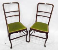 Pair of mahogany standard chairs with horizontal splats and on cabriole shaped supports and pad
