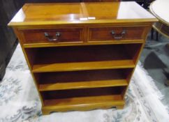 Modern yew wood veneer chest of two short drawers, with open shelves below, on bracket feet,