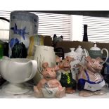 Collection of Nat West money box pigs including four babies, a school boy and a school girl,