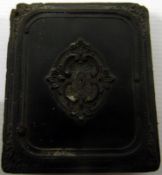 Victorian travelling photograph frame decorated as a book enclosing a pair of photographs