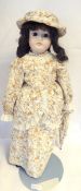 "C M Bergmann, Waltershausen"-style bisque headed doll with fixed brown eyes and closed mouth,